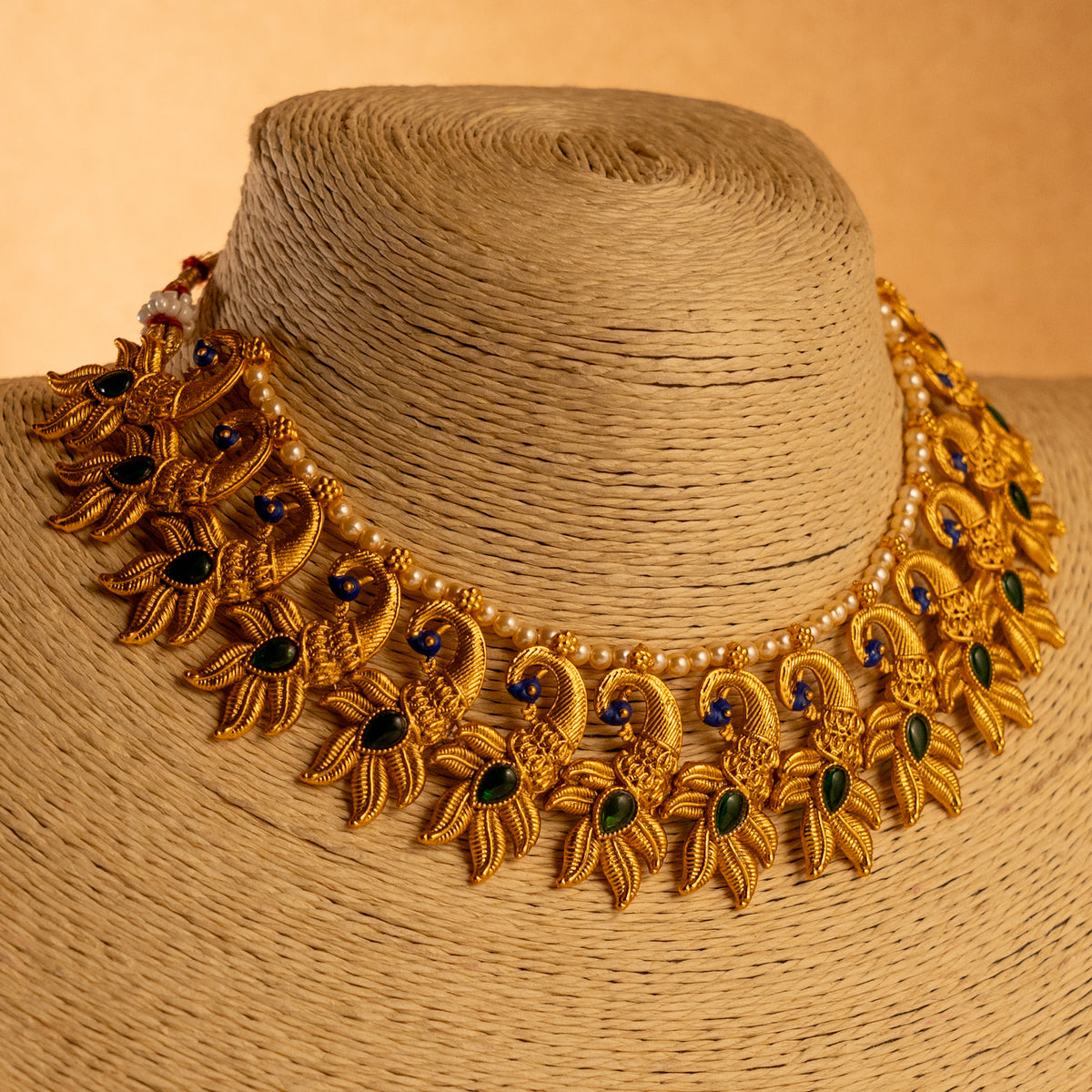 VARNA PEACOCK GOLD TONED ANTIQUE FINISH NECKLACE WITH EARRINGS NL179