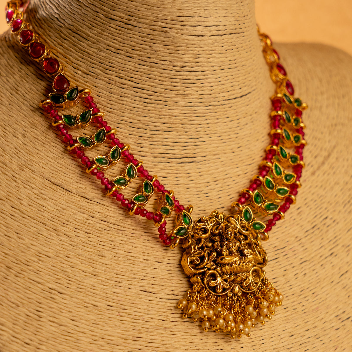 LAKSHMI GOLD TONED ANTIQUE FINISH TEMPLE NECKLACE WITH EARRINGS NL185