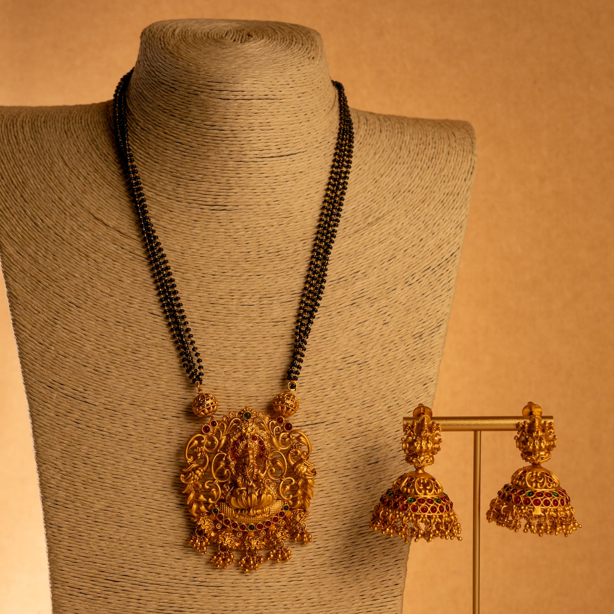 KARUNA GOLD TONED ANTIQUE FINISH TEMPLE NECKLACE WITH EARRINGS NL191