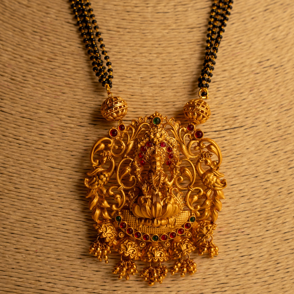 KARUNA GOLD TONED ANTIQUE FINISH TEMPLE NECKLACE WITH EARRINGS NL191