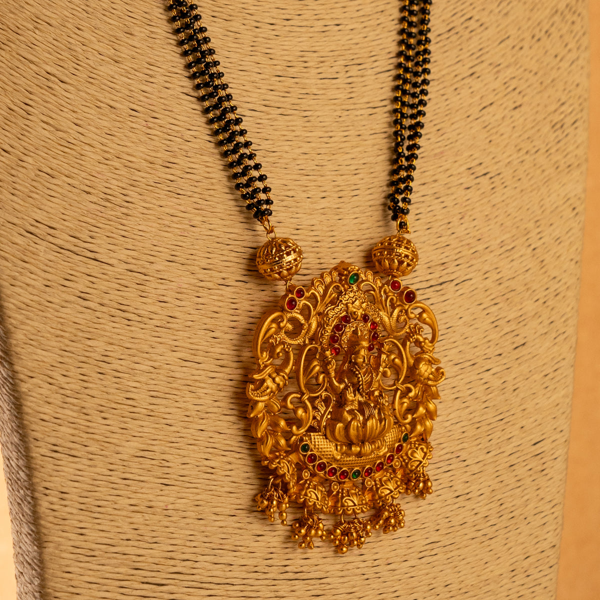 KARUNA GOLD TONED ANTIQUE FINISH TEMPLE NECKLACE WITH EARRINGS NL191