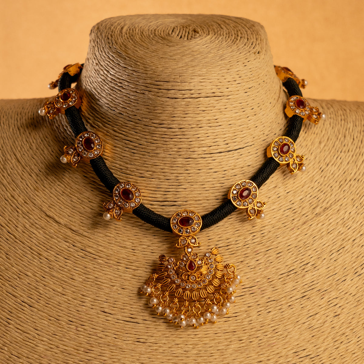 KALYANI GOLD TONED ANTIQUE FINISH NECKLACE WITH EARRINGS NL190