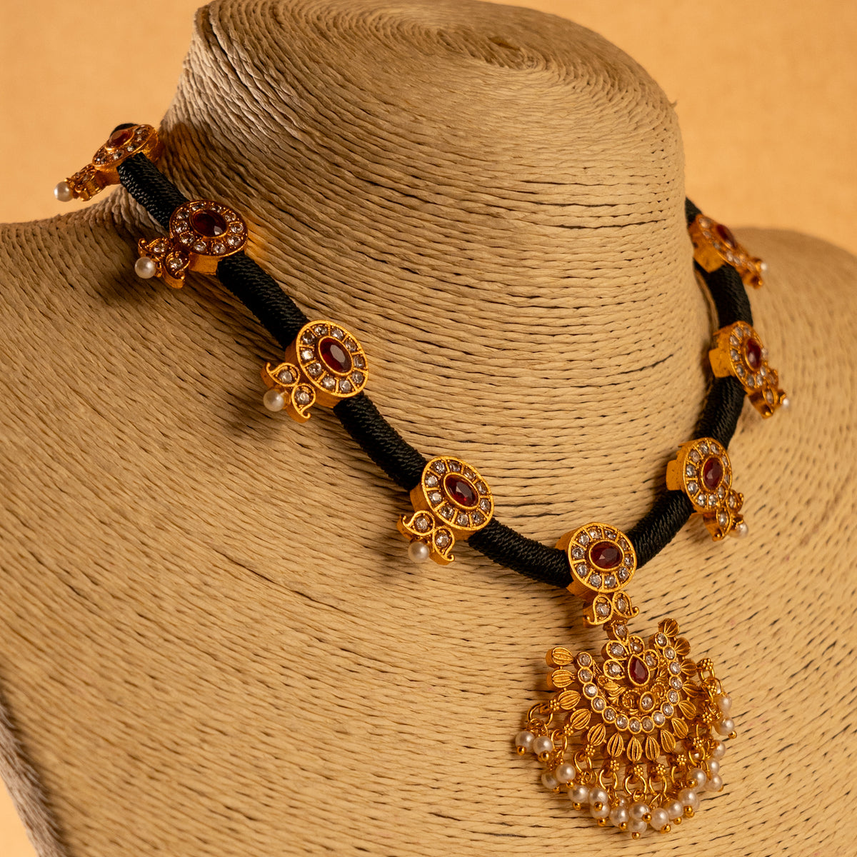 KALYANI GOLD TONED ANTIQUE FINISH NECKLACE WITH EARRINGS NL190