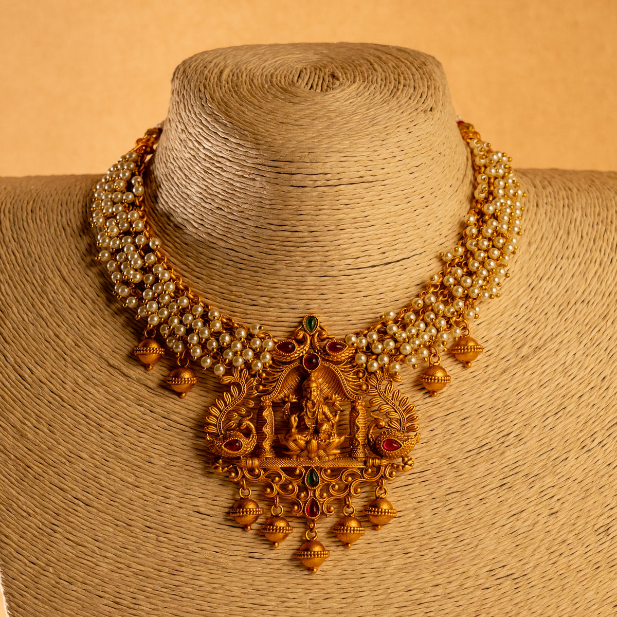 NIRANJANA GOLD TONED ANTIQUE FINISH TEMPLE NECKLACE WITH EARRINGS NL189