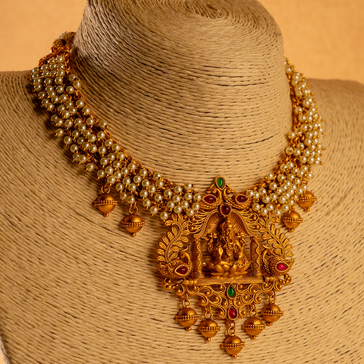 NIRANJANA GOLD TONED ANTIQUE FINISH TEMPLE NECKLACE WITH EARRINGS NL189