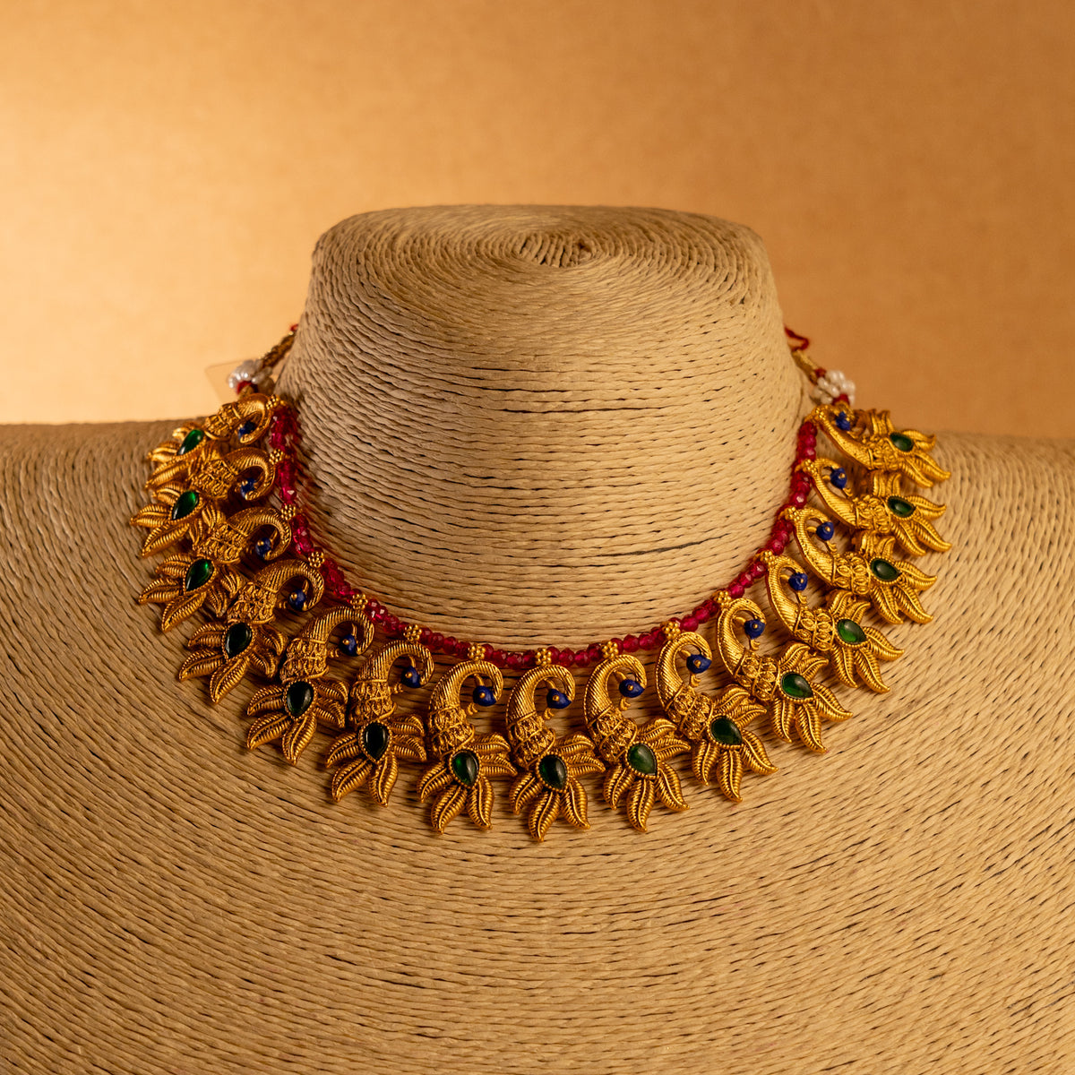 VARNA PEACOCK GOLD TONED ANTIQUE FINISH NECKLACE WITH EARRINGS NL179