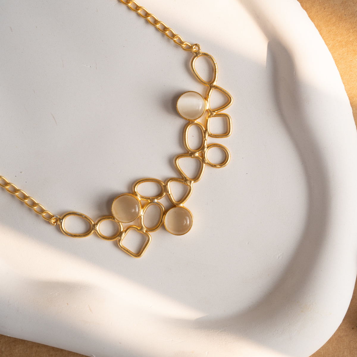 NIHARA GOLD TONED HANDMADE HAND HAMMERED NECKLACE WITH EARRINGS NL225