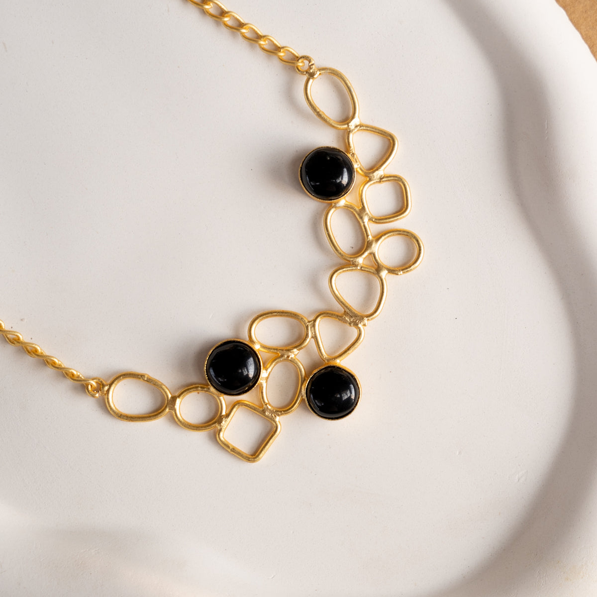 NIHARA GOLD TONED HANDMADE HAND HAMMERED NECKLACE WITH EARRINGS NL225