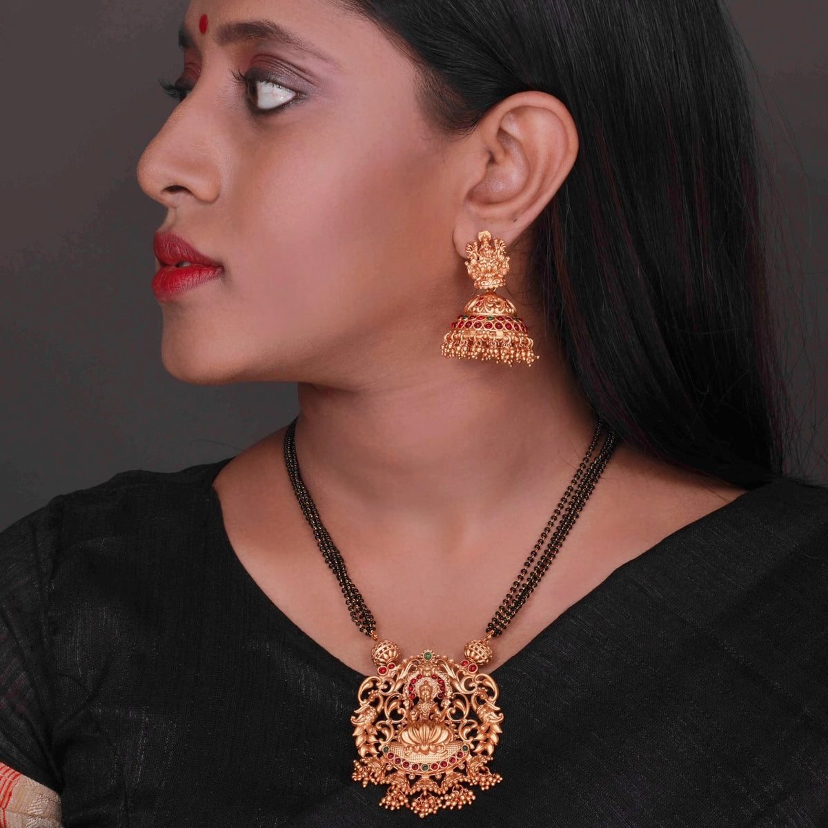 KARUNA GOLD TONED ANTIQUE FINISH TEMPLE NECKLACE WITH EARRINGS NL191