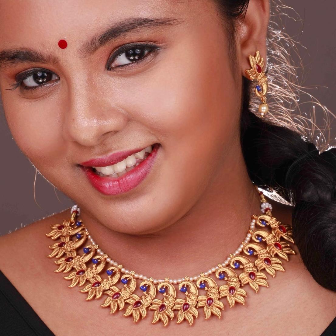 VARNA PEACOCK GOLD TONED ANTIQUE FINISH NECKLACE WITH EARRINGS NL179